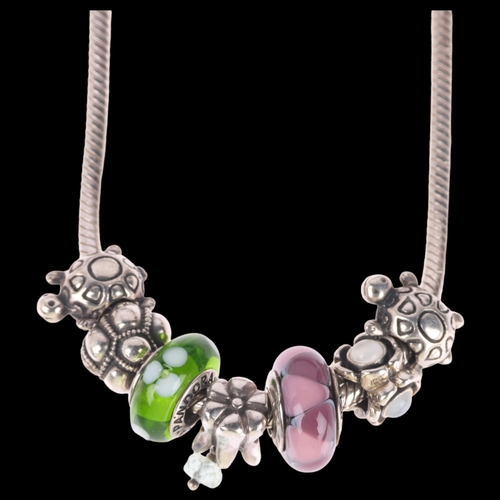 1409 - PANDORA - a sterling silver snake link charm necklace, with 7 charms and 2 spacer charms, 41cm, 54.4... 