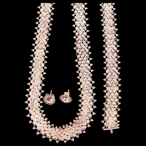 1427 - An Eastern white metal necklace and bracelet set, and a similar pair of stud earrings, 36g total (3)