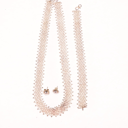 1427 - An Eastern white metal necklace and bracelet set, and a similar pair of stud earrings, 36g total (3)