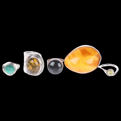 1430 - 5 Continental silver rings, including amber, 49.7g total (5)