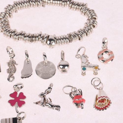 1435 - LINKS OF LONDON - a sterling silver bracelet and a quantity of sterling silver charms, both boxed