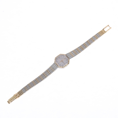 1021 - OMEGA - a lady's bi-metal quartz bracelet watch, ref. 591.0011, silvered dial with applied gilt bato... 