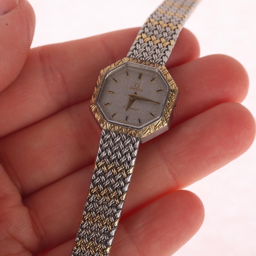 1021 - OMEGA - a lady's bi-metal quartz bracelet watch, ref. 591.0011, silvered dial with applied gilt bato... 