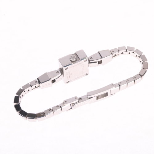 1025 - GUCCI - a lady's stainless steel and diamond Mini G quartz bracelet watch, ref. 102, black dial with... 