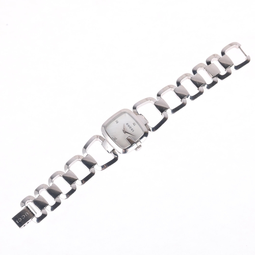 1026 - GUCCI - a lady's stainless steel G-Timeless quartz bracelet watch, ref. 125.5, white mother-of-pearl... 