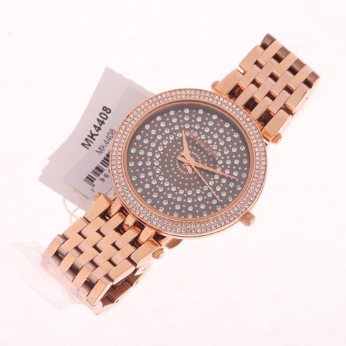 1033 - MICHAEL KORS - an unworn lady's rose gold plated stainless steel Darci quartz bracelet watch, ref. M... 