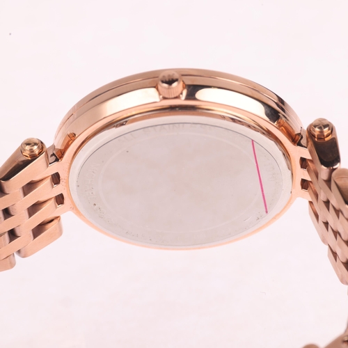 1033 - MICHAEL KORS - an unworn lady's rose gold plated stainless steel Darci quartz bracelet watch, ref. M... 