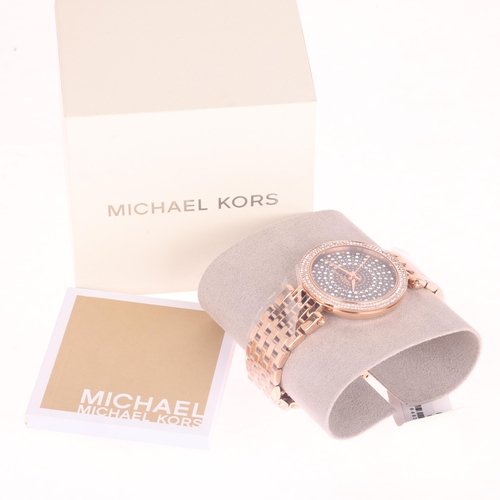 1033 - MICHAEL KORS - an unworn lady's rose gold plated stainless steel Darci quartz bracelet watch, ref. M... 