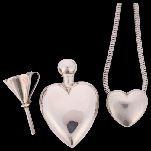 1457 - An Elizabeth II miniature silver heart scent flask and refill funnel, London 1995, and a silver hear... 