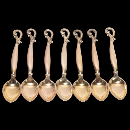 1496 - HORSENS SOLVVAREFABRIK - a set of 7 Art Nouveau Danish silver-gilt coffee spoons, 9cm