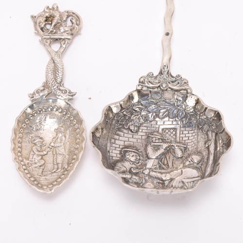 1498 - 2 Antique Continental silver spoons, comprising larger novelty serving spoon with windmill terminal,... 