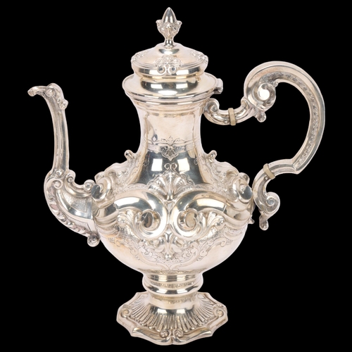 1524 - A Portuguese 833 standard silver coffee pot, pedestal baluster form with high relief embossed and ch... 