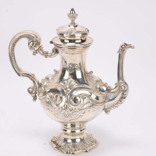 1524 - A Portuguese 833 standard silver coffee pot, pedestal baluster form with high relief embossed and ch... 