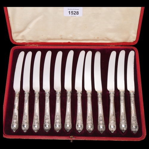 1528 - A cased set of 12 George V silver-handled dessert knives, Thomas Bradbury & Sons Ltd, Sheffield 1910... 