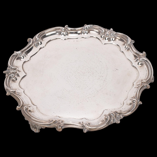 1533 - An Edwardian silver circular salver, Elkington & Co, Birmingham 1901, scalloped border with cast fol... 