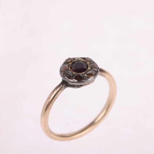 1102 - An Antique ruby and diamond cluster ring, set with oval mixed-cut ruby surrounded by Dutch rose-cut ... 