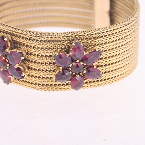 1103 - A 9ct gold garnet triple flowerhead mesh bracelet, set with round and pear-cut garnets, apparently u... 