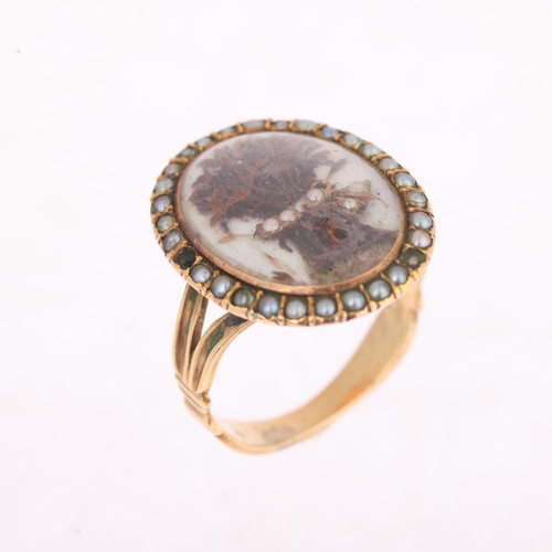 1105 - A Georgian hairwork and split pearl mourning ring, circa 1780, the central applied hairwork panel de... 