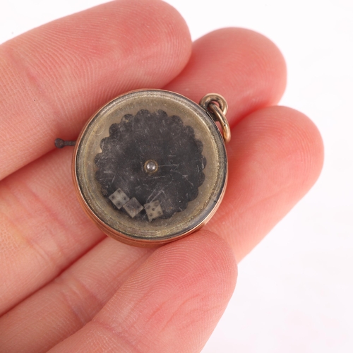 1110 - An Antique Victorian dice game spinner fob, circa 1890, the glazed compartment containing 3 miniatur... 