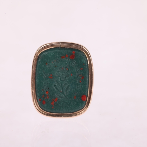 1111 - An Antique Victorian bloodstone 'Forget-Me-Not' seal fob, the panel intaglio carved with wording and... 