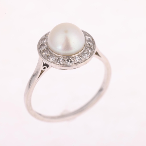 1117 - A platinum pearl and diamond cluster ring, set with a 7.9mm whole pearl surrounded by eight-cut diam... 