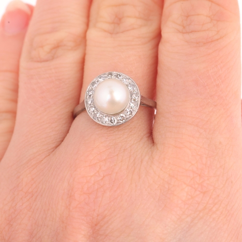 1117 - A platinum pearl and diamond cluster ring, set with a 7.9mm whole pearl surrounded by eight-cut diam... 