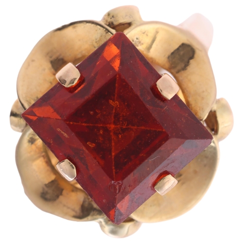 1119 - A late 20th century hessonite orange garnet dress ring, claw set with 9ct rectangular step-cut garne... 