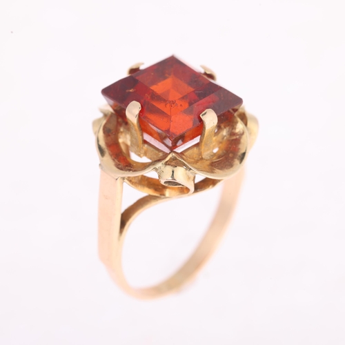 1119 - A late 20th century hessonite orange garnet dress ring, claw set with 9ct rectangular step-cut garne... 