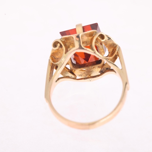 1119 - A late 20th century hessonite orange garnet dress ring, claw set with 9ct rectangular step-cut garne... 