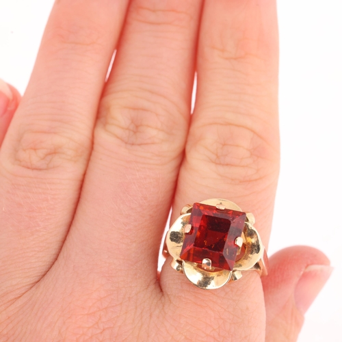 1119 - A late 20th century hessonite orange garnet dress ring, claw set with 9ct rectangular step-cut garne... 