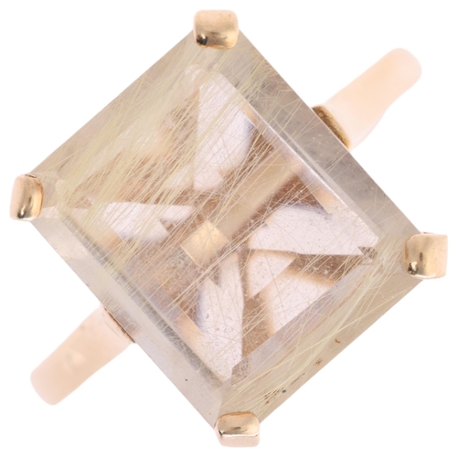 1120 - A 9ct gold rutilated quartz dress ring, claw set with rectangular step-cut quartz, setting height 12... 