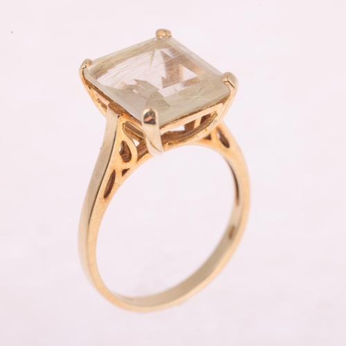 1120 - A 9ct gold rutilated quartz dress ring, claw set with rectangular step-cut quartz, setting height 12... 