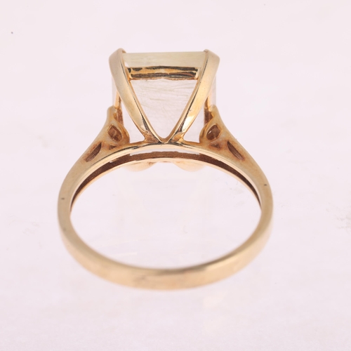 1120 - A 9ct gold rutilated quartz dress ring, claw set with rectangular step-cut quartz, setting height 12... 