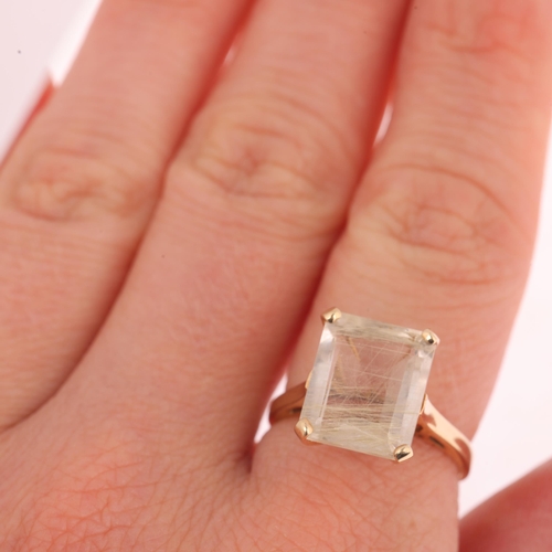 1120 - A 9ct gold rutilated quartz dress ring, claw set with rectangular step-cut quartz, setting height 12... 