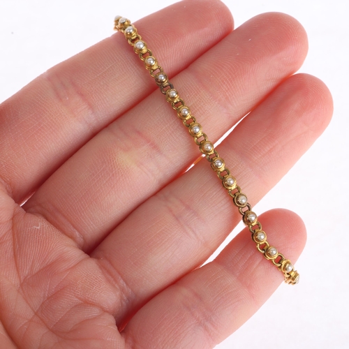 1122 - A 22ct gold pearl line bracelet, set with split pearls, apparently unmarked and tests as 22ct, 16cm,... 