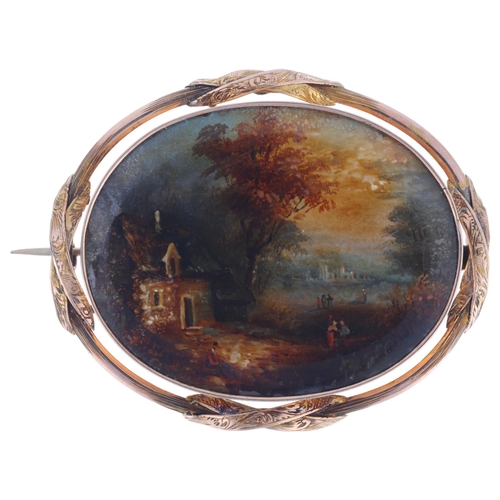 1126 - A Victorian 9ct gold miniature hand painted watercolour landscape scene brooch, the panel beneath co... 