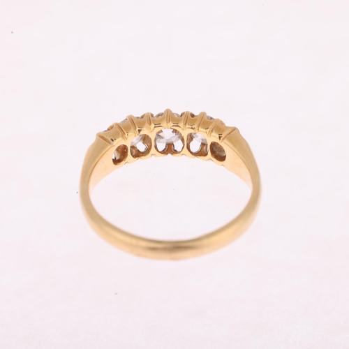 1131 - An 18ct gold graduated five stone diamond half hoop ring, set with old-cut diamonds, total diamond c... 