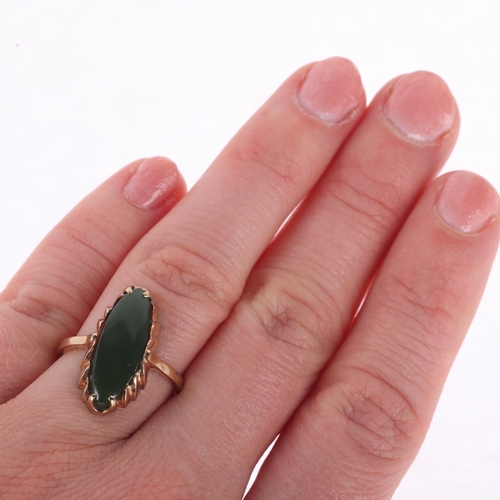 1143 - A 9ct gold jadeite panel ring, set with marquise cabochon jade, setting height 20.5mm, size M, 2.7g