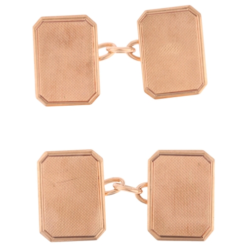 1148 - A pair of Art Deco 9ct gold octagonal cufflinks, maker AC Co, Birmingham 1940, engine turned decorat... 