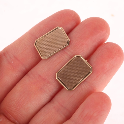 1148 - A pair of Art Deco 9ct gold octagonal cufflinks, maker AC Co, Birmingham 1940, engine turned decorat... 