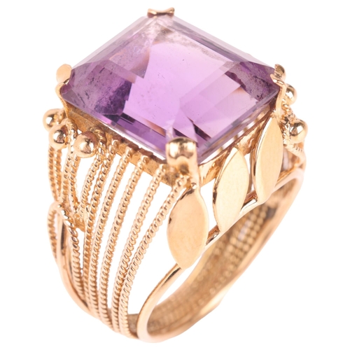 1157 - A Continental 18ct gold amethyst dress ring, set with octagonal step-cut amethyst with wirework moun... 