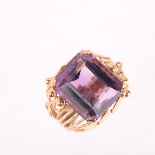 1157 - A Continental 18ct gold amethyst dress ring, set with octagonal step-cut amethyst with wirework moun... 