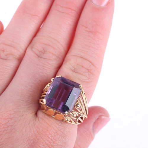 1157 - A Continental 18ct gold amethyst dress ring, set with octagonal step-cut amethyst with wirework moun... 