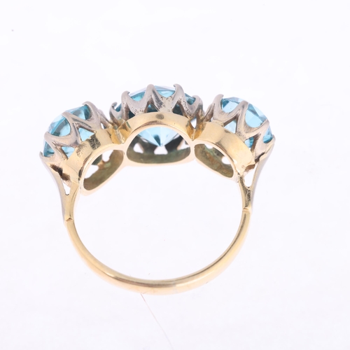 1158 - An 18ct gold three stone blue zircon ring, claw set with round-cut zircons, setting height 10.5mm, s... 