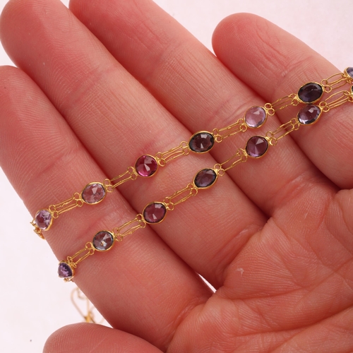 1162 - A 14ct gold vari-hue zircon line necklace, the bezel set graduated round and oval zircons with doubl... 