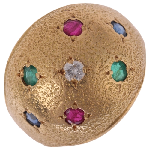 1163 - A French 18ct gold gem set bombe ring, set with diamond ruby emerald and sapphire on textured ground... 