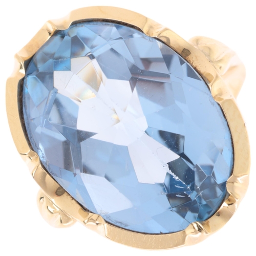 1167 - A 14ct gold blue topaz dress ring, set with oval rose-cut blue topaz, setting height 20.2mm, size H/... 