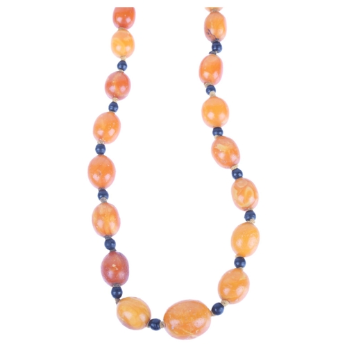 1169 - A single-row graduated amber bead necklace, beads measure 20.7 - 12.4mm, 50cm, 41.6g