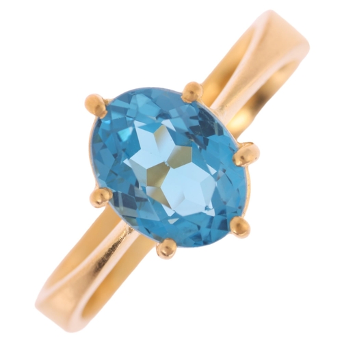 1173 - A 22ct gold single stone blue topaz ring, maker SH, Birmingham 1939, claw set with oval mixed-cut to... 