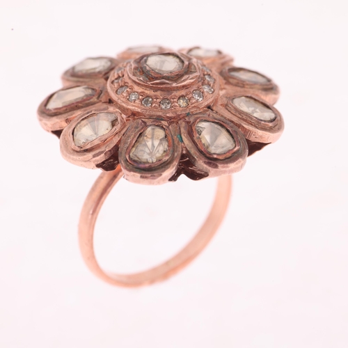 1180 - An Indian Polki diamond flowerhead cluster ring, unmarked mount tests as 14ct rose gold and base met... 